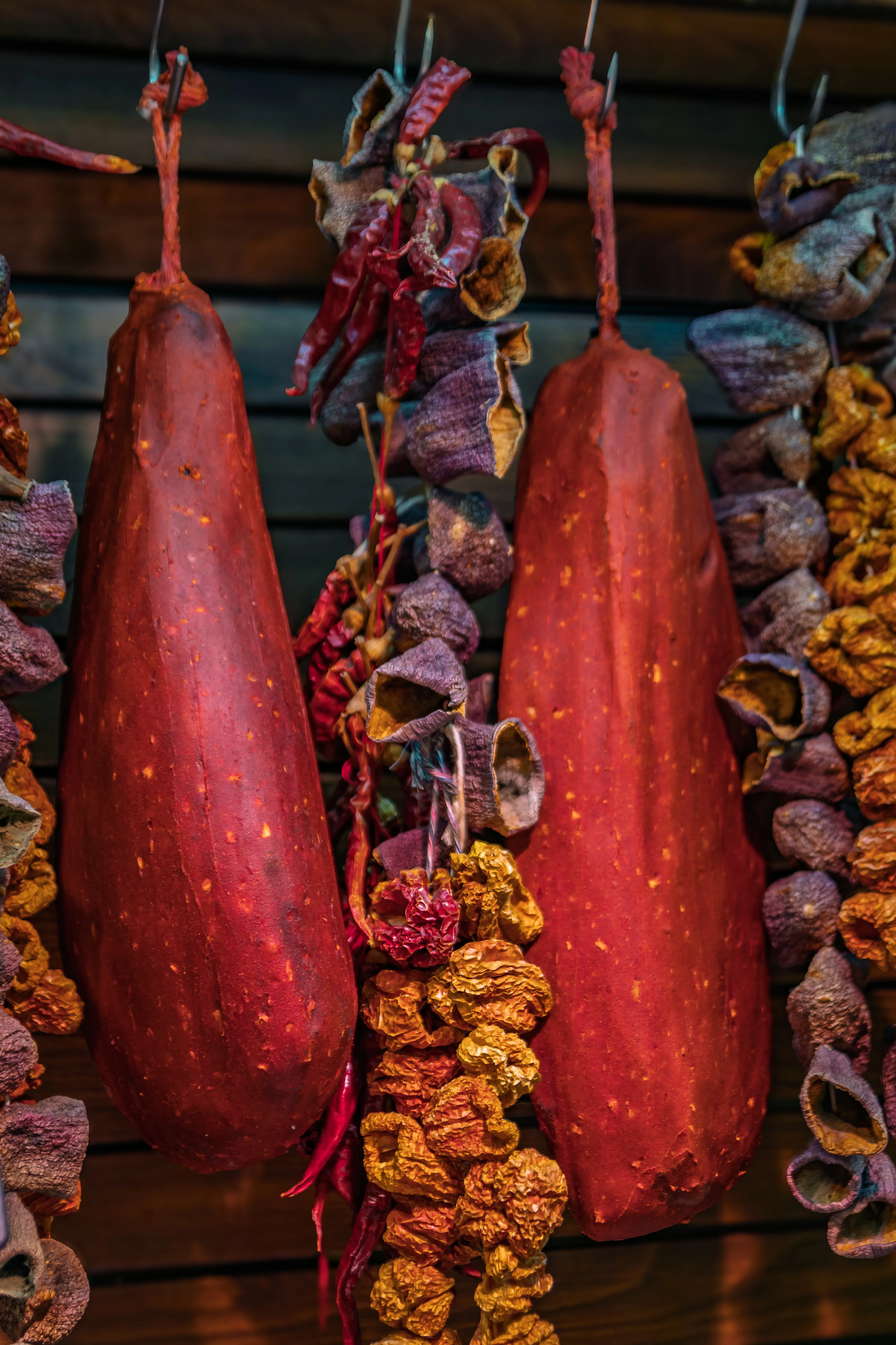 Long strings of dried eggplants and peppers hanging beside Turkish pastırma at the Egyptian Bazaar in Istanbul