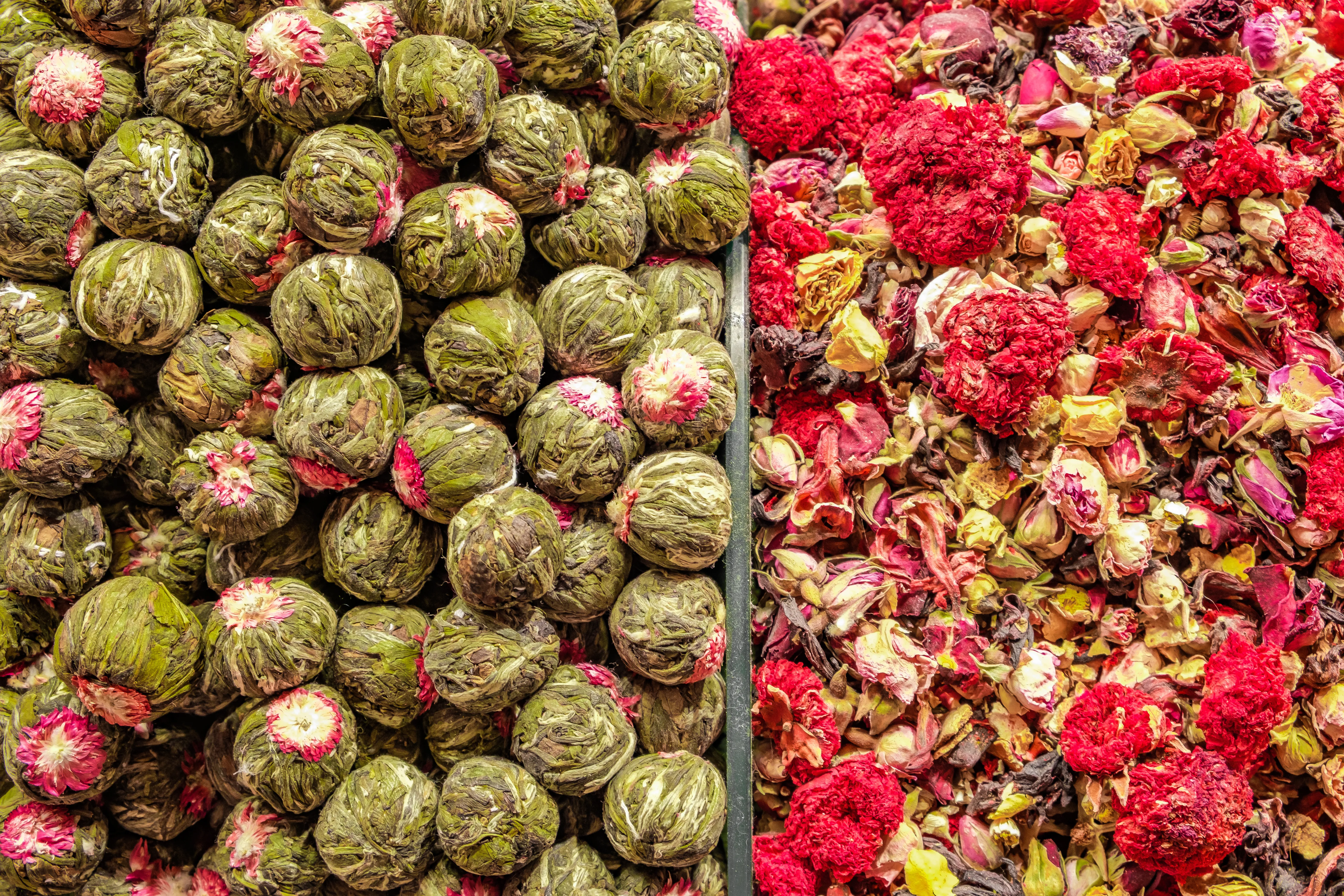 Flower teas displayed in bulk glass jars at an Istanbul market stall