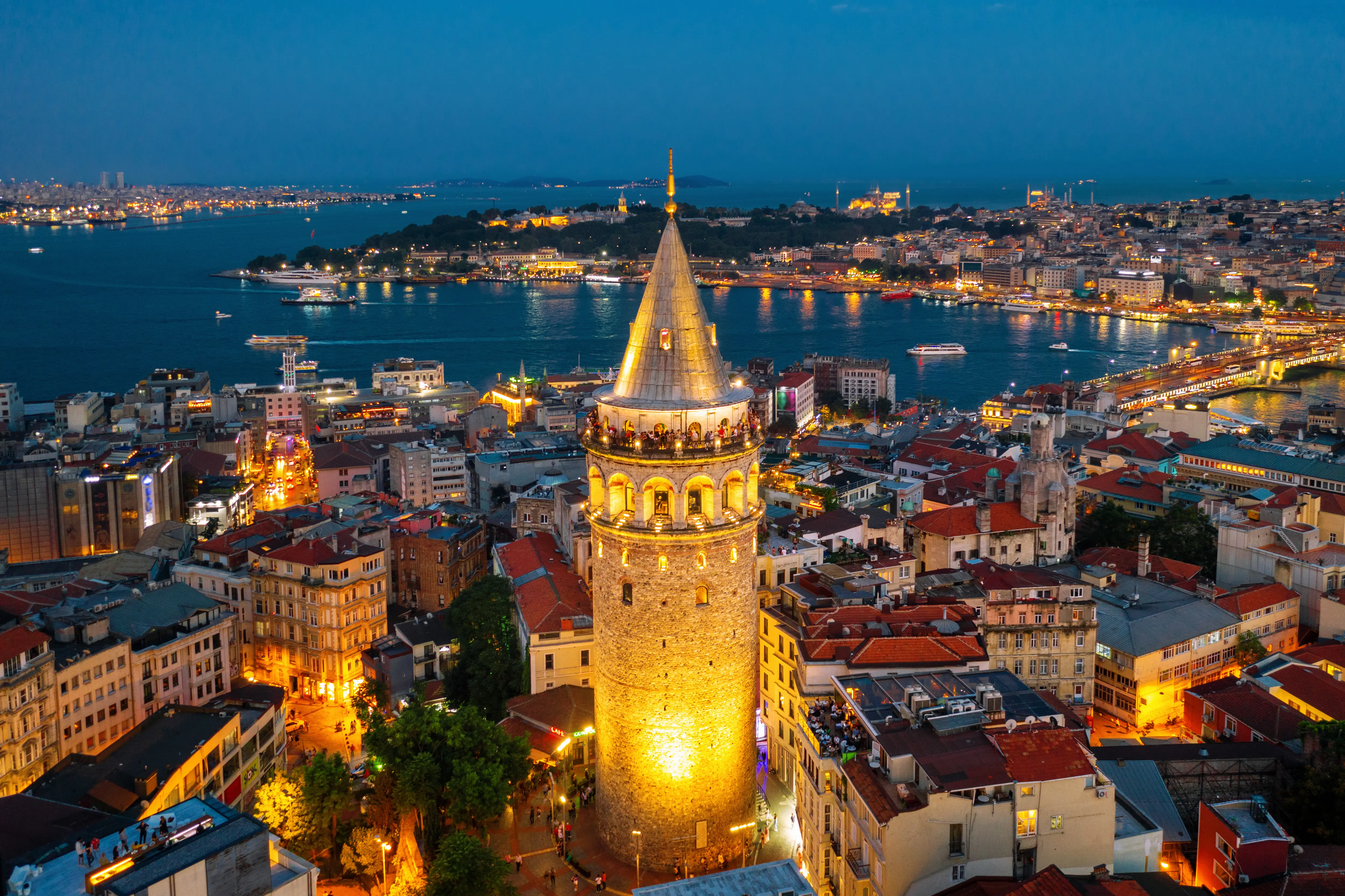 The Galata Tower illuminated at night in Istanbul