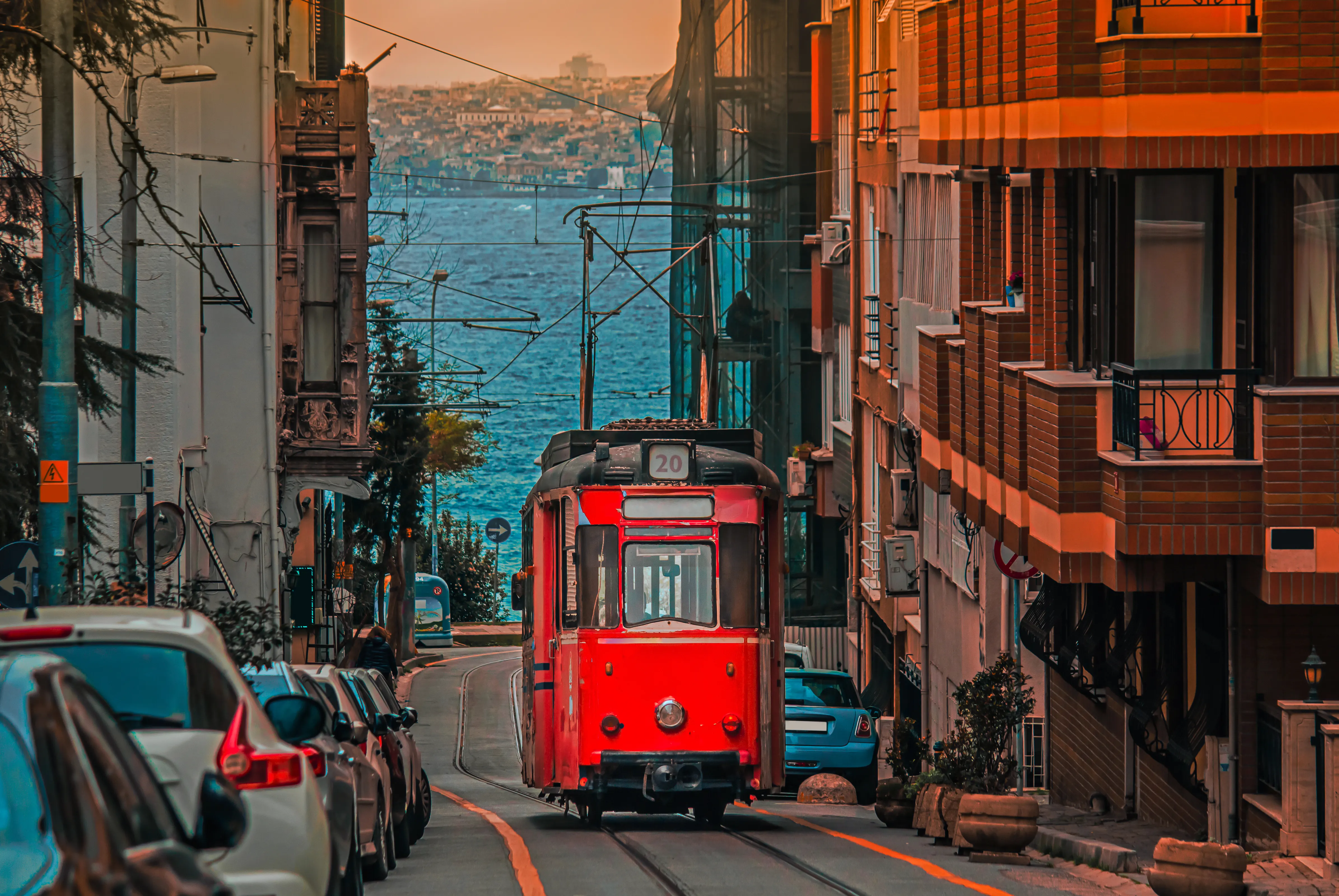 An old nostalgic tram running through the colorful streets of Kadıköy
