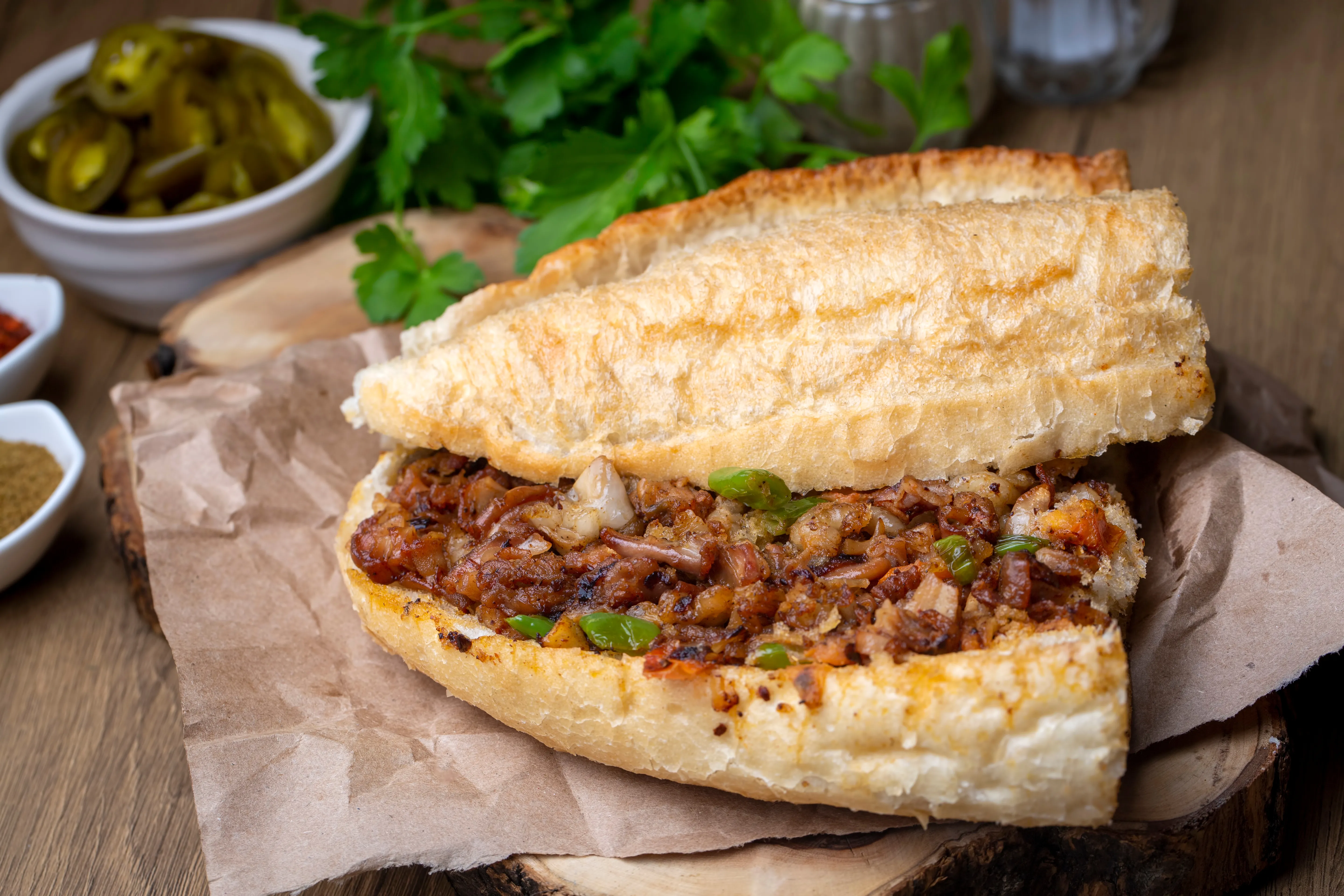 A plate of traditional Turkish kokoreç, grilled and seasoned lamb intestines, İzmir style