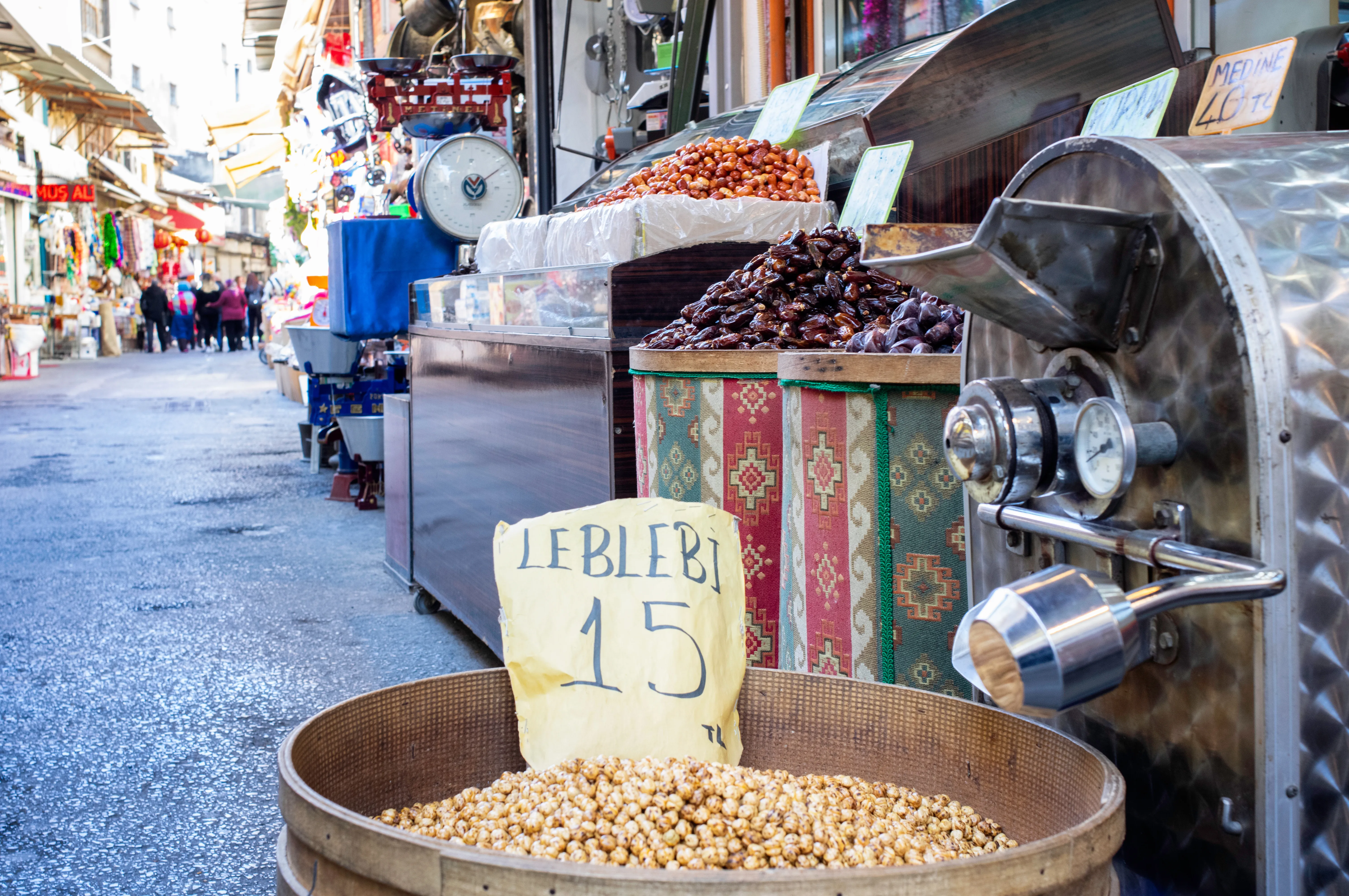 Fresh roasted yellow chickpeas (leblebi) on sale at a Turkish bazaar stall