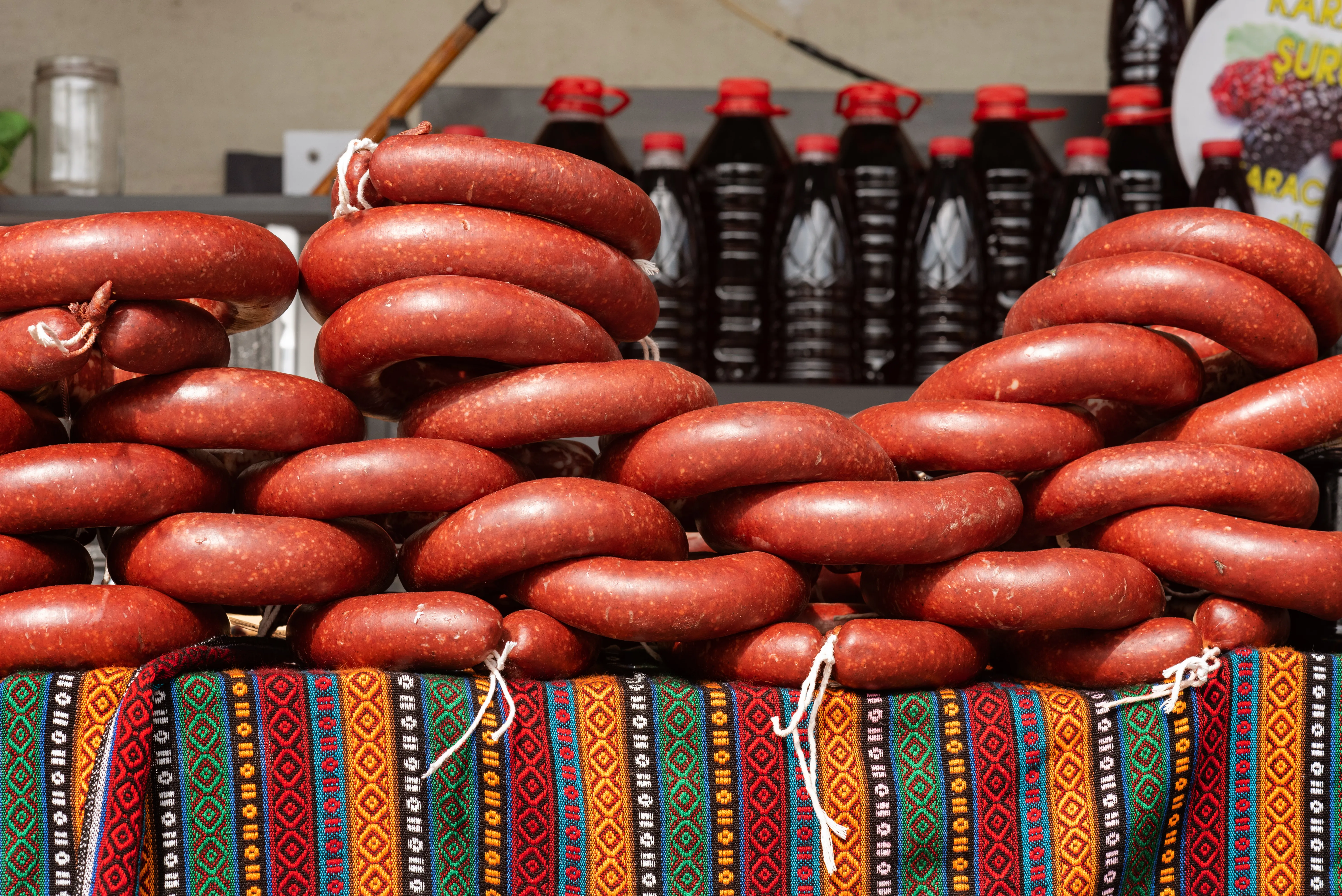 Dry-cured Turkish sucuk sausages hanging for sale at a bazaar butcher