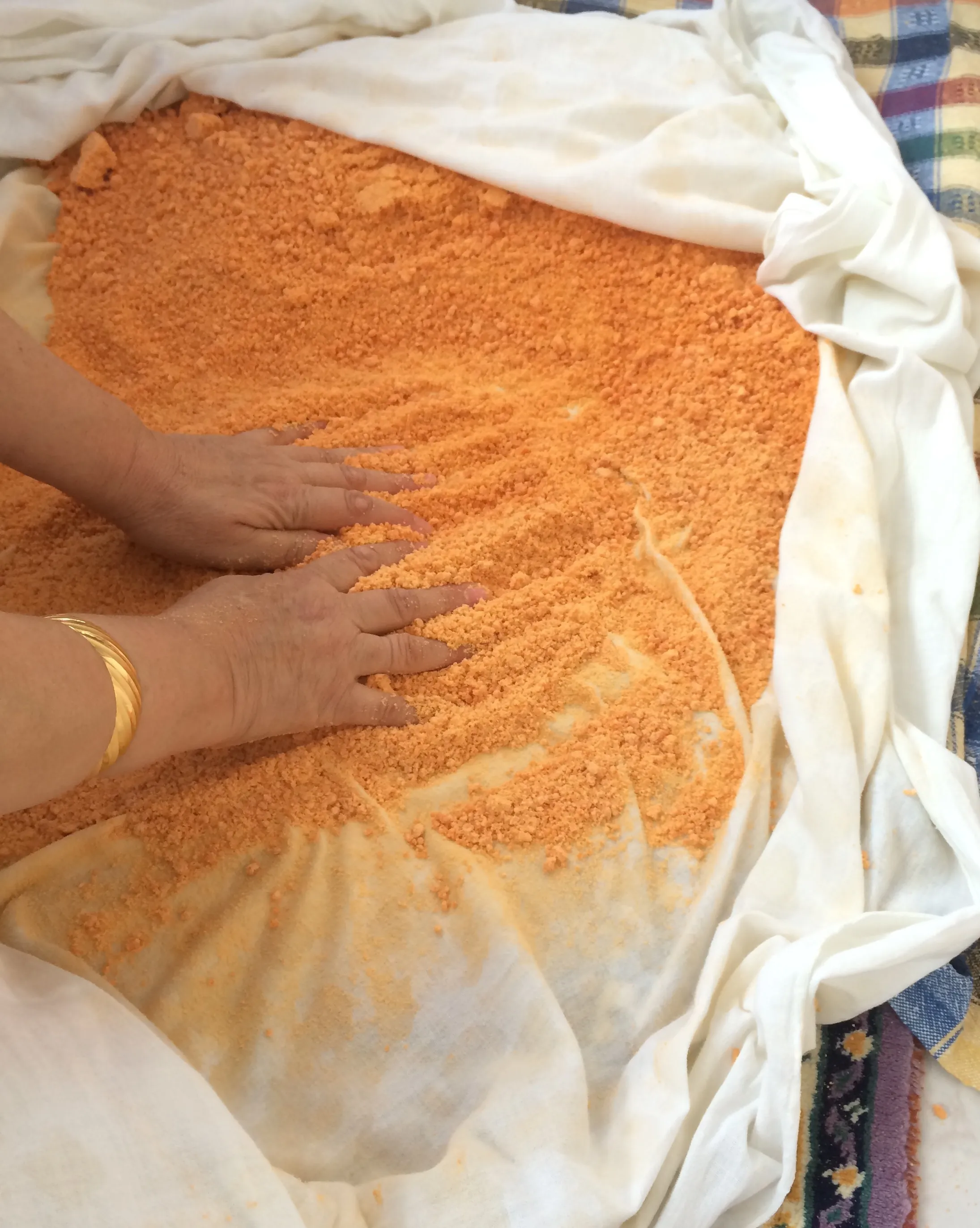 Tarhana, a fermented mixture of yogurt, tomato and grain, being prepared and dried in the traditional Turkish way