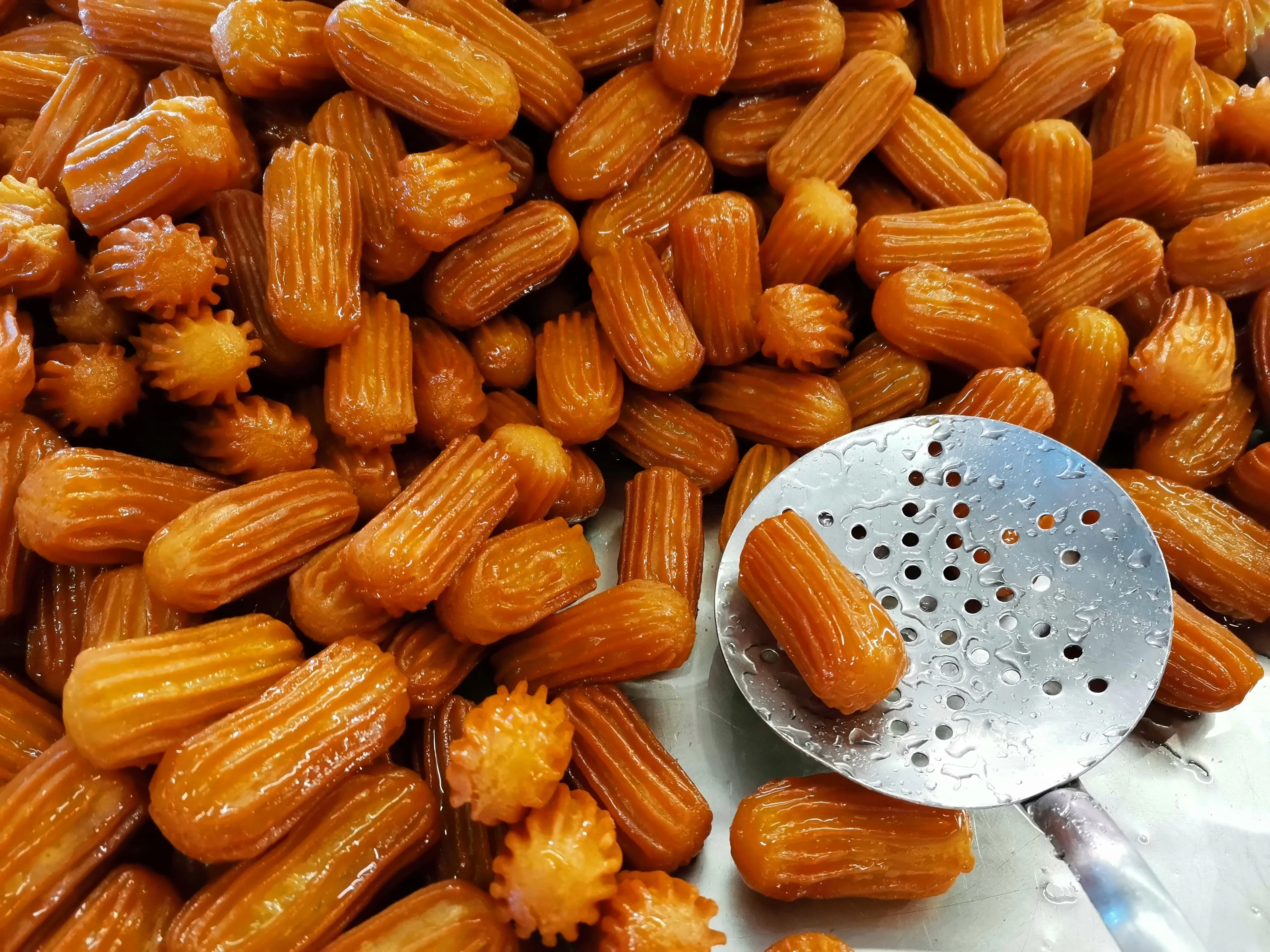 Deep-fried Turkish tulumba pastries soaked in syrup